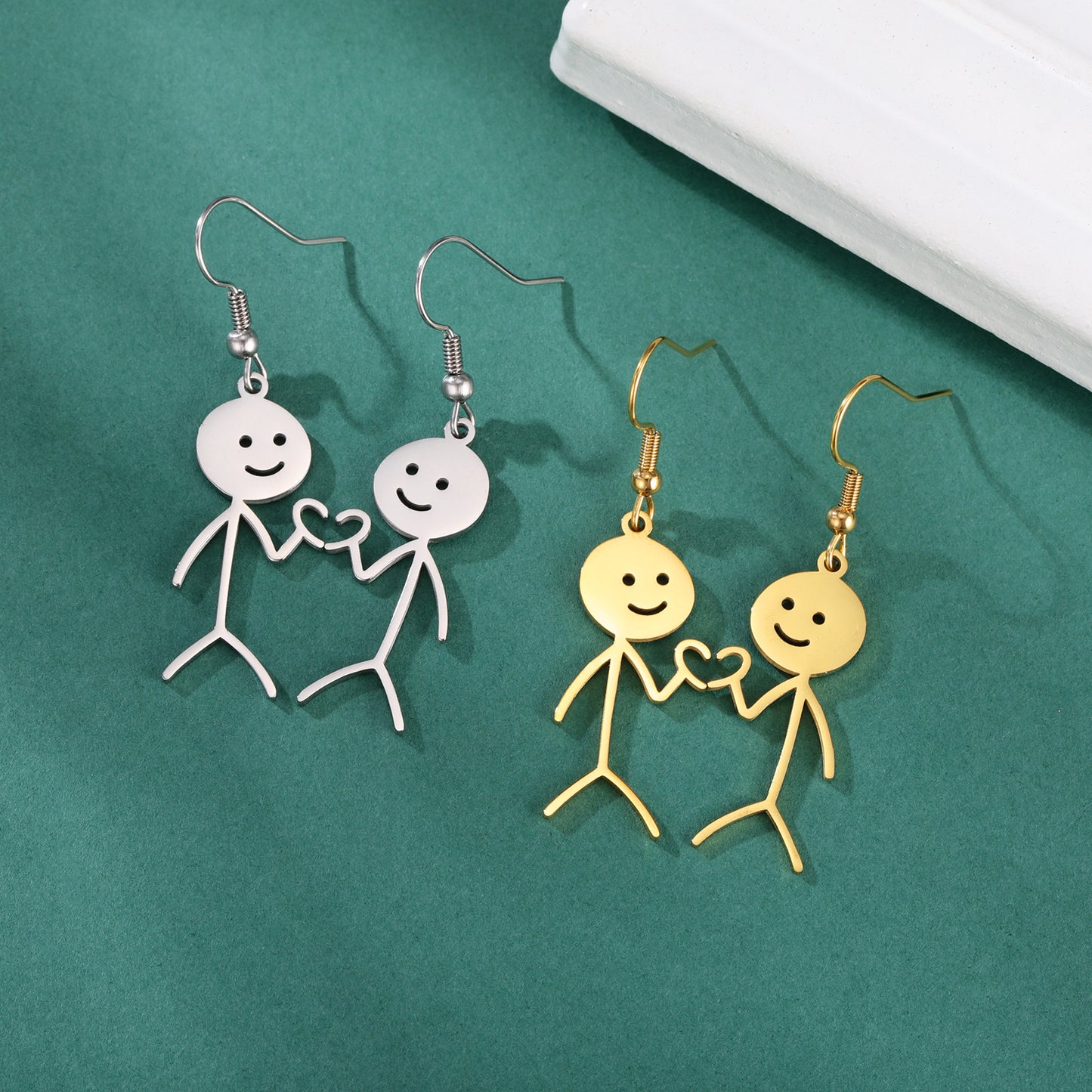 Boucles d'oreilles de dessin animé creuses coupées en acier