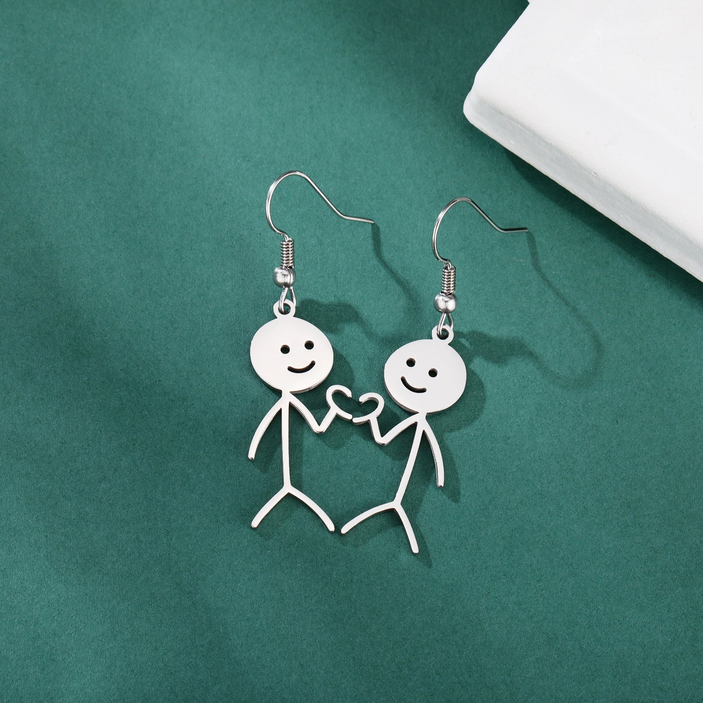 Boucles d'oreilles de dessin animé creuses coupées en acier