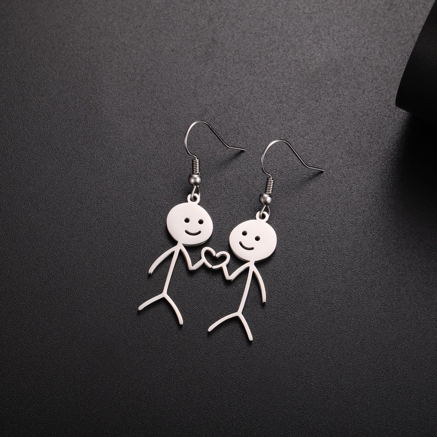 Boucles d'oreilles de dessin animé creuses coupées en acier