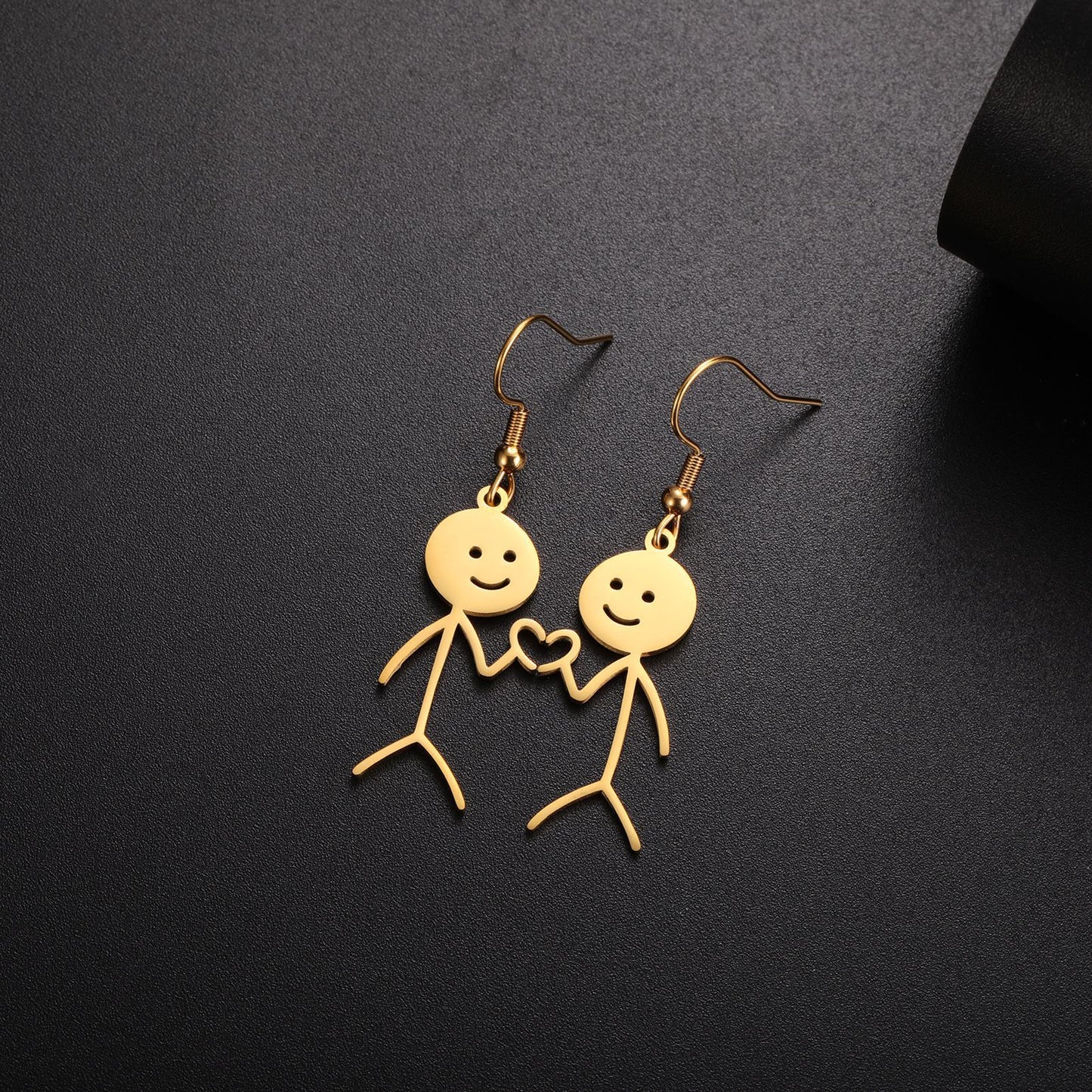 Boucles d'oreilles de dessin animé creuses coupées en acier