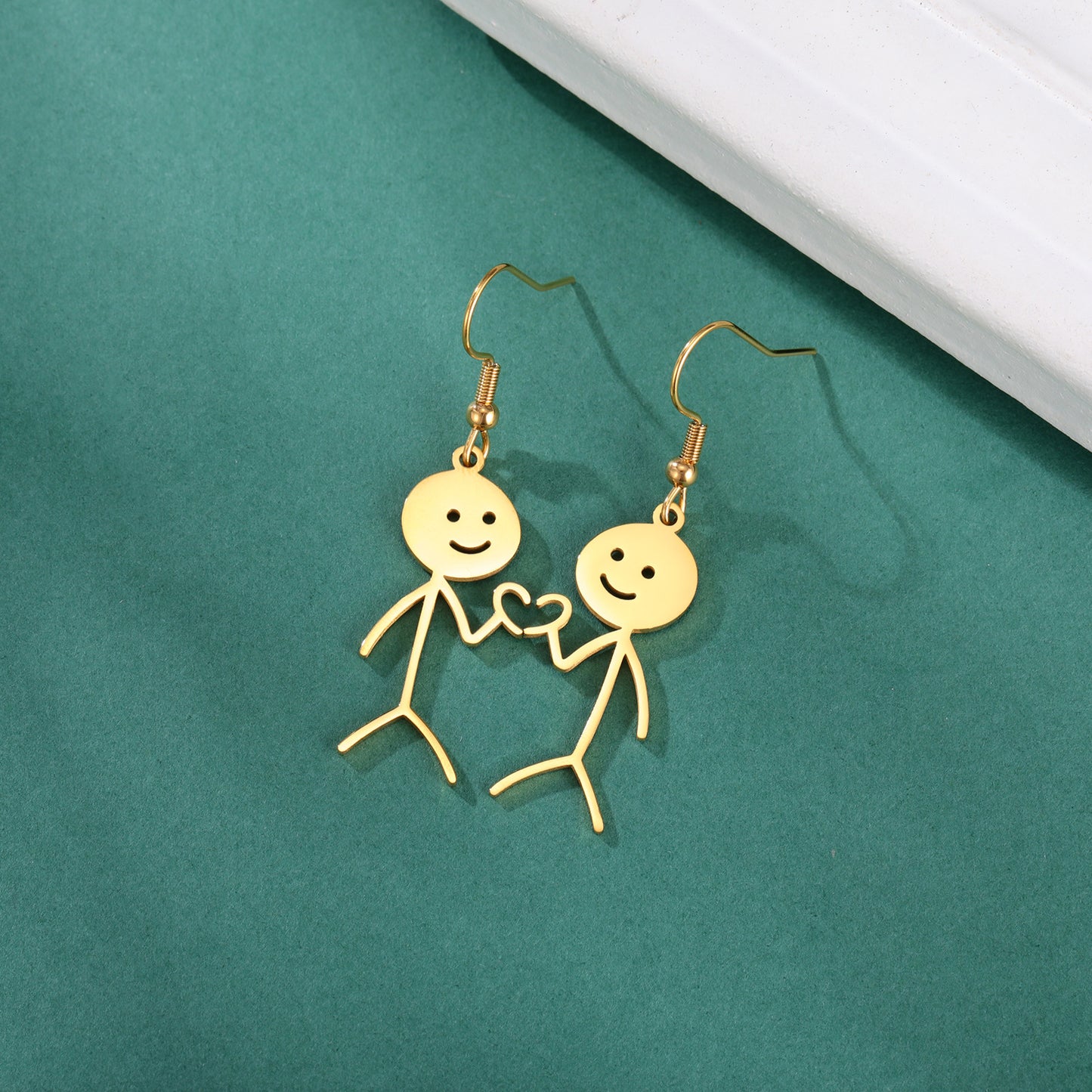 Boucles d'oreilles de dessin animé creuses coupées en acier