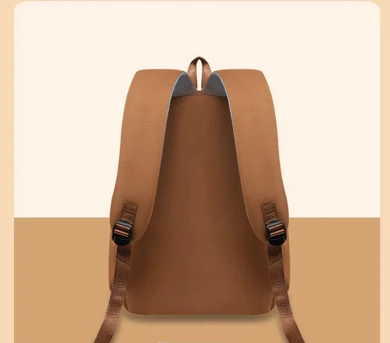Brown backpack on a beige background